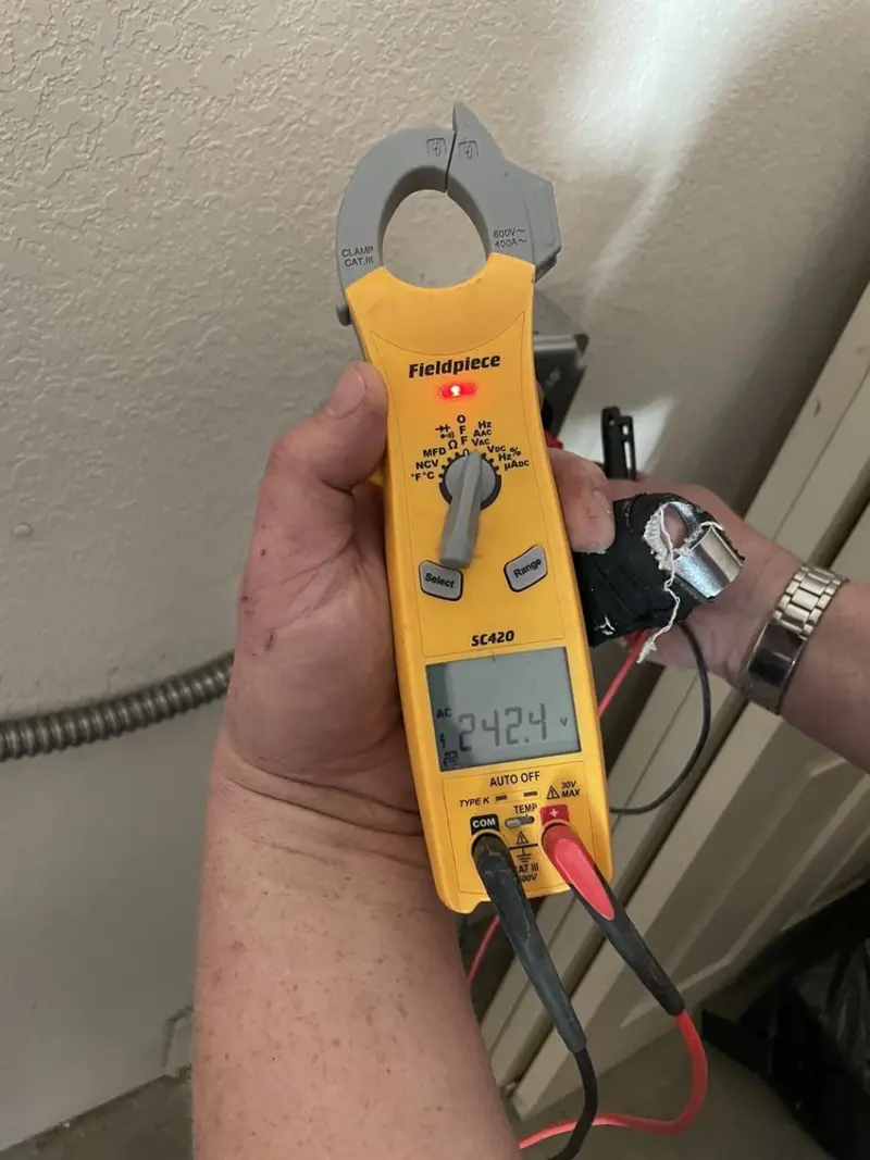 Voltage testing with clamp meter during Electrical Installation Services in Pittsfield